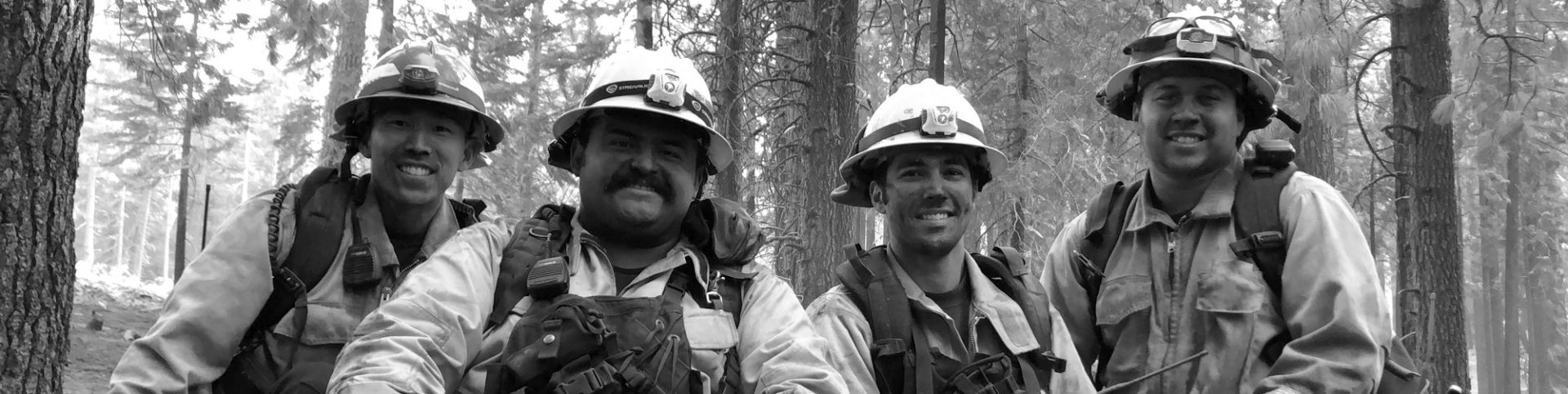 Header four fire fighters posed
